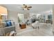 Inviting living room with neutral walls, plush seating, and open access to the kitchen and dining room at 580 Greenbriar Farm Trl, Siler City, NC 27344