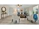 Comfortable living room featuring light walls, stylish decor, and wood-look flooring at 580 Greenbriar Farm Trl, Siler City, NC 27344