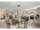 Open concept living and dining room area features modern lighting, neutral paint and lots of windows at 580 Greenbriar Farm Trl, Siler City, NC 27344
