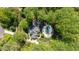 Overhead view showing a home with an in-ground pool surrounded by green trees, promoting privacy at 5912 Weather Rock Ct, Raleigh, NC 27613