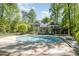 Stunning backyard featuring a large pool, deck, gazebo, and lush landscaping for outdoor enjoyment at 5912 Weather Rock Ct, Raleigh, NC 27613
