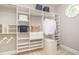 Custom closet design with adjustable shelves and stylish storage bins, perfect for organization at 5912 Weather Rock Ct, Raleigh, NC 27613