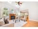 Spacious living room with a fireplace, lots of natural light, and stylish decor for comfortable living at 5912 Weather Rock Ct, Raleigh, NC 27613