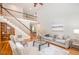 Spacious living room with hardwood floors, soaring ceilings and an open staircase at 5912 Weather Rock Ct, Raleigh, NC 27613
