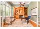 Inviting office space with custom built-ins, fireplace, and comfortable seating area at 5912 Weather Rock Ct, Raleigh, NC 27613