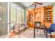 Inviting office with custom built-ins, large window and an accent chair at 5912 Weather Rock Ct, Raleigh, NC 27613