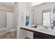 Half bathroom with large mirror and modern fixtures at 632 Hunters Ridge Dr, Fuquay Varina, NC 27526