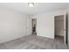 Spacious carpeted bedroom with doorways to the bathroom and walk-in closet at 632 Hunters Ridge Dr, Fuquay Varina, NC 27526