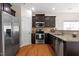 Well-equipped kitchen with dark wood cabinets, granite countertops, and stainless appliances at 632 Hunters Ridge Dr, Fuquay Varina, NC 27526