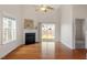 Living room boasts a fireplace, hardwood floors, sliding glass doors to backyard at 632 Hunters Ridge Dr, Fuquay Varina, NC 27526
