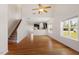 Open living space with hardwood floors and view into the kitchen and backyard at 632 Hunters Ridge Dr, Fuquay Varina, NC 27526