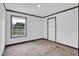 Bedroom featuring wood-look floors and natural light from the window at 66 Privette Way, Zebulon, NC 27597