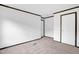 Spacious bedroom with neutral carpet, white walls, and minimal design at 66 Privette Way, Zebulon, NC 27597