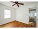 Bedroom featuring hardwood floors, natural light, and white walls at 704 N King Charles Rd, Raleigh, NC 27610