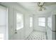 Bright kitchen featuring a door to the outside and stainless steel appliances at 704 N King Charles Rd, Raleigh, NC 27610