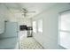 Updated kitchen with a ceiling fan, modern stainless steel appliances, and a door to the outside at 704 N King Charles Rd, Raleigh, NC 27610