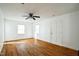 Spacious living room with hardwood floors, natural light, white walls, and entrance at 704 N King Charles Rd, Raleigh, NC 27610