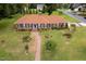 Stunning aerial view of the charming home showcasing its meticulously landscaped yard and welcoming curb appeal at 705 N Gurney St, Burlington, NC 27215