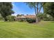 Beautiful backyard featuring a lush lawn, established landscaping, and a serene setting for relaxation at 705 N Gurney St, Burlington, NC 27215