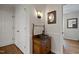 Charming half bath with rustic vanity and unique lighting fixture, accentuating the home's character at 705 N Gurney St, Burlington, NC 27215