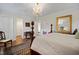 Elegant bedroom with a four-poster bed and a view into multiple rooms at 705 N Gurney St, Burlington, NC 27215