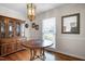 Elegant dining room featuring a wooden table, hutch, and classic chandelier at 705 N Gurney St, Burlington, NC 27215