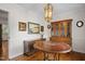 Charming dining room with period furniture and light fixture at 705 N Gurney St, Burlington, NC 27215