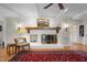 Cozy living room showcasing a fireplace with a wooden mantle and classic decor at 705 N Gurney St, Burlington, NC 27215