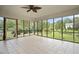 Inviting screened porch with large windows, blending indoor comfort with picturesque backyard views at 705 N Gurney St, Burlington, NC 27215