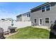 Spacious backyard featuring a patio with outdoor seating and a white privacy fence at 713 Putney Hill Rd, Zebulon, NC 27597