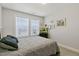 Inviting bedroom showcasing large windows, ambient lighting, and personal touches for a cozy atmosphere at 713 Putney Hill Rd, Zebulon, NC 27597