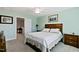 Inviting bedroom features cozy carpet, a comfortable bed, and a serene atmosphere at 713 Putney Hill Rd, Zebulon, NC 27597