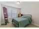 Cozy bedroom featuring a comfortable bed, natural light from windows, and a classic wooden dresser at 713 Putney Hill Rd, Zebulon, NC 27597