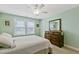 Charming bedroom with a large window, a dresser, and a relaxing atmosphere at 713 Putney Hill Rd, Zebulon, NC 27597
