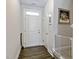 Bright and airy foyer featuring hardwood floors, a staircase, and fresh white paint at 713 Putney Hill Rd, Zebulon, NC 27597
