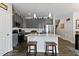 Contemporary kitchen featuring an island with seating, stainless appliances, and modern cabinetry at 713 Putney Hill Rd, Zebulon, NC 27597