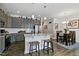 Spacious kitchen with an island, stainless steel appliances, and an open dining area at 713 Putney Hill Rd, Zebulon, NC 27597