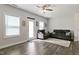 Bright living room features a ceiling fan, wood floors and neutral color scheme at 713 Putney Hill Rd, Zebulon, NC 27597