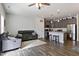 Open-concept living space featuring a modern kitchen, cozy seating area, and stylish decor at 713 Putney Hill Rd, Zebulon, NC 27597