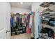 Spacious walk-in closet with ample hanging space and shelving for organized storage of clothes and accessories at 713 Putney Hill Rd, Zebulon, NC 27597