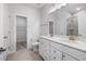 Bright bathroom with double sinks, a toilet, and a walk-in shower reflected in the large mirror at 728 Ben Ledi Ct, Raleigh, NC 27603