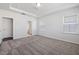 Bright bedroom features neutral paint, carpet flooring, tray ceiling, and ensuite bathroom at 728 Ben Ledi Ct, Raleigh, NC 27603