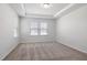 Bright bedroom features a tray ceiling, neutral paint, carpet flooring and lots of natural light at 728 Ben Ledi Ct, Raleigh, NC 27603