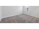 Bedroom with plush carpet, a window with blinds, and white walls at 728 Ben Ledi Ct, Raleigh, NC 27603