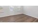 Dining room with wood-look flooring, natural light, and direct access to the front porch at 728 Ben Ledi Ct, Raleigh, NC 27603