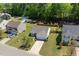 Aerial view of home featuring well-maintained landscaping, a two-car garage, and a traditional suburban setting at 729 Golden Horseshoe Ln, Sanford, NC 27330