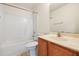 Bathroom featuring tiled shower/tub, vanity with sink, and large mirror at 729 Golden Horseshoe Ln, Sanford, NC 27330
