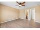 This spacious bedroom offers wood floors, a ceiling fan and access to bathroom and closet at 729 Golden Horseshoe Ln, Sanford, NC 27330