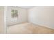 Bedroom featuring neutral paint, carpet and a window to let in natural light at 729 Golden Horseshoe Ln, Sanford, NC 27330