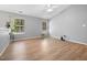 Bright living room featuring wood-look floors, neutral walls, and plenty of natural light at 729 Golden Horseshoe Ln, Sanford, NC 27330